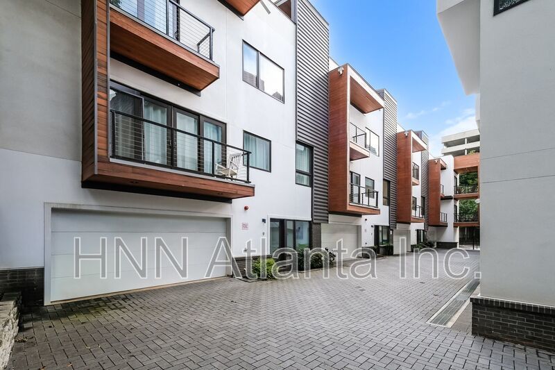50% OFF APPLICATION FEE! Sleek 2BR Townhome-Style Condo with Rooftop Deck property image