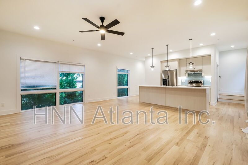 50% OFF APPLICATION FEE! Sleek 2BR Townhome-Style Condo with Rooftop Deck property image