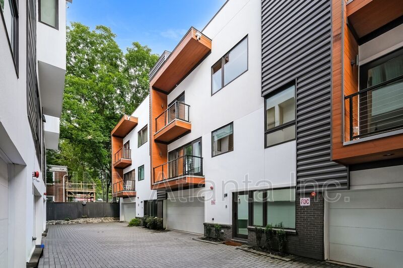 50% OFF APPLICATION FEE! Sleek 2BR Townhome-Style Condo with Rooftop Deck property image