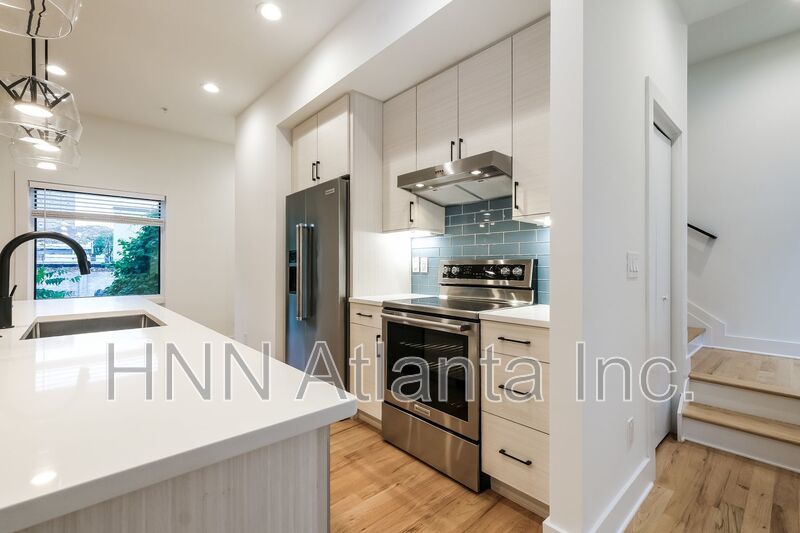 50% OFF APPLICATION FEE! Sleek 2BR Townhome-Style Condo with Rooftop Deck property image