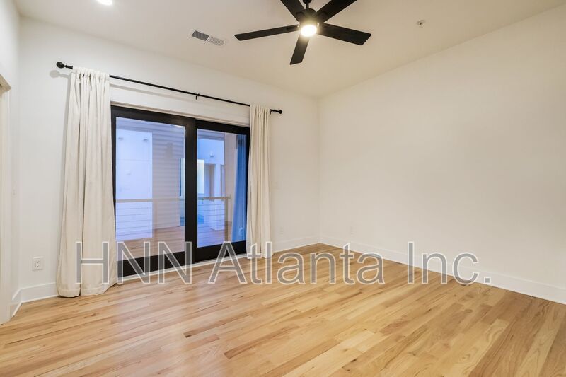 50% OFF APPLICATION FEE! Sleek 2BR Townhome-Style Condo with Rooftop Deck property image