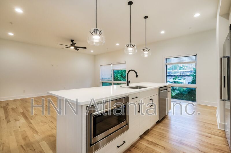 50% OFF APPLICATION FEE! Sleek 2BR Townhome-Style Condo with Rooftop Deck property image