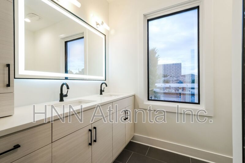 50% OFF APPLICATION FEE! Sleek 2BR Townhome-Style Condo with Rooftop Deck property image