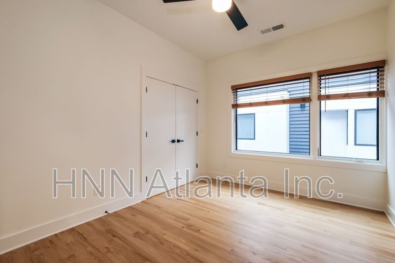50% OFF APPLICATION FEE! Sleek 2BR Townhome-Style Condo with Rooftop Deck property image
