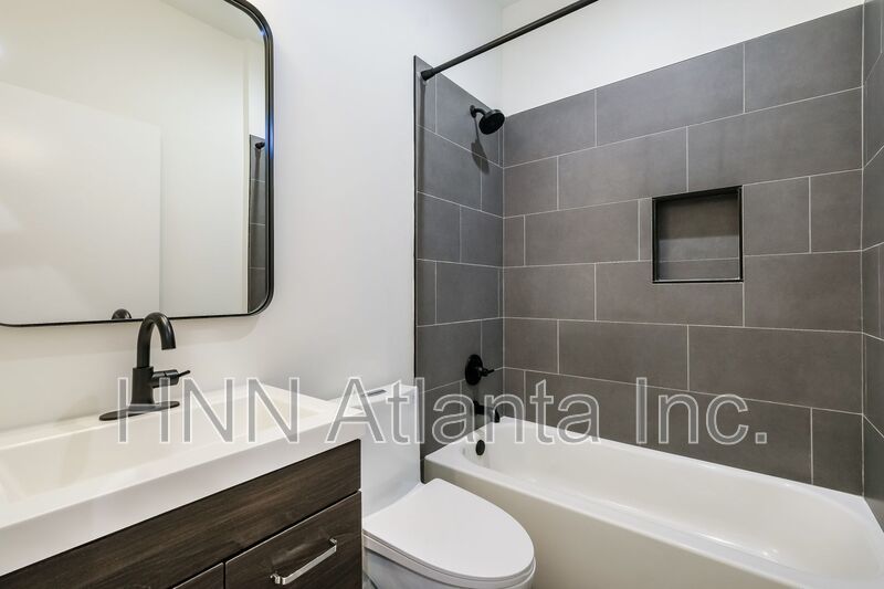 50% OFF APPLICATION FEE! Sleek 2BR Townhome-Style Condo with Rooftop Deck property image