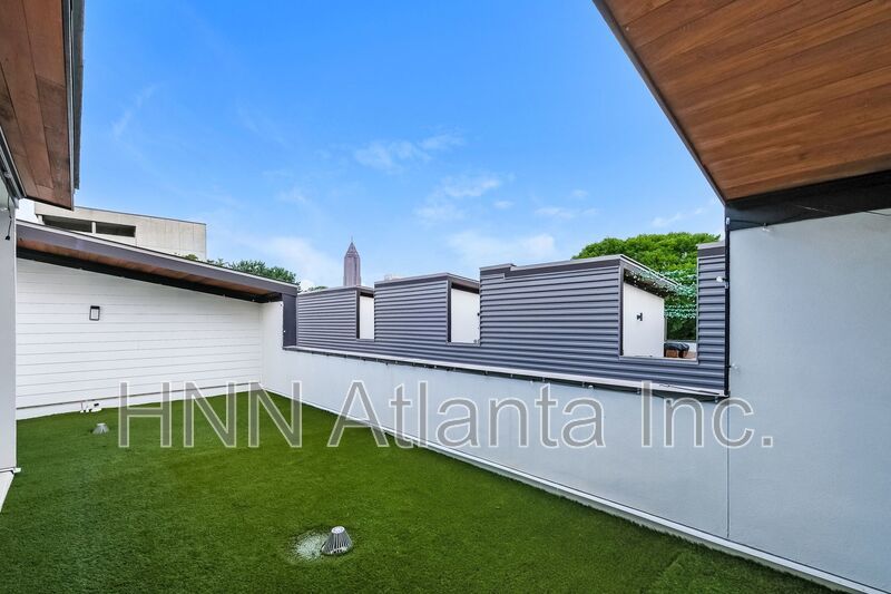 50% OFF APPLICATION FEE! Sleek 2BR Townhome-Style Condo with Rooftop Deck property image