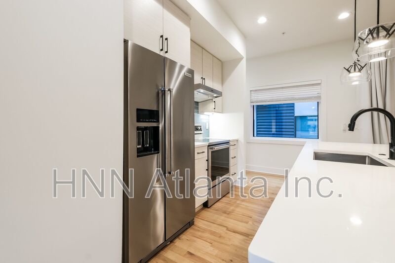 50% OFF APPLICATION FEE! Sleek 2BR Townhome-Style Condo with Rooftop Deck property image